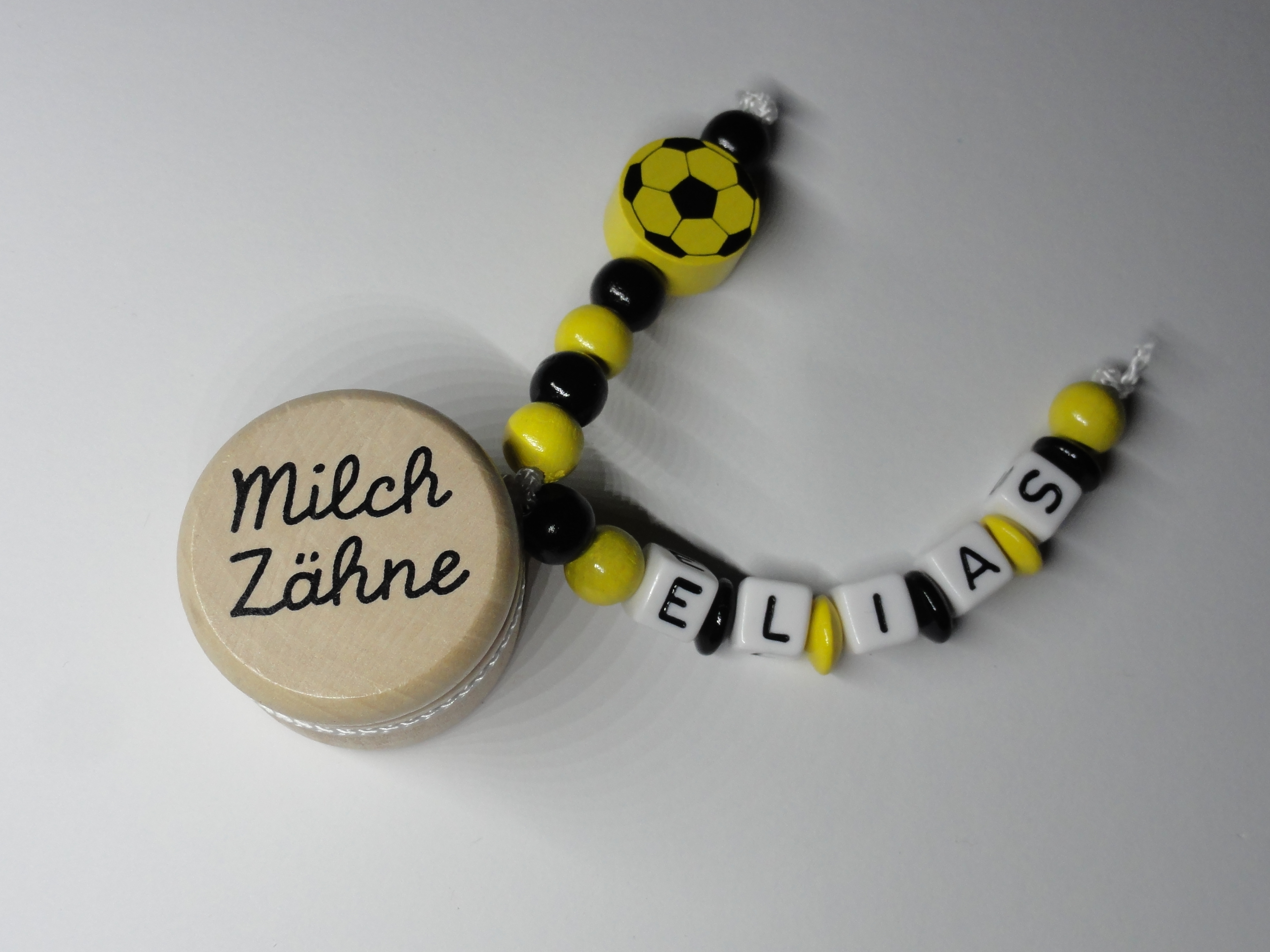 Milchzahndose Fußball in Schwarz und Gelb